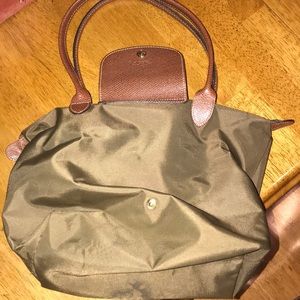 Green medium long champ bag with large straps.